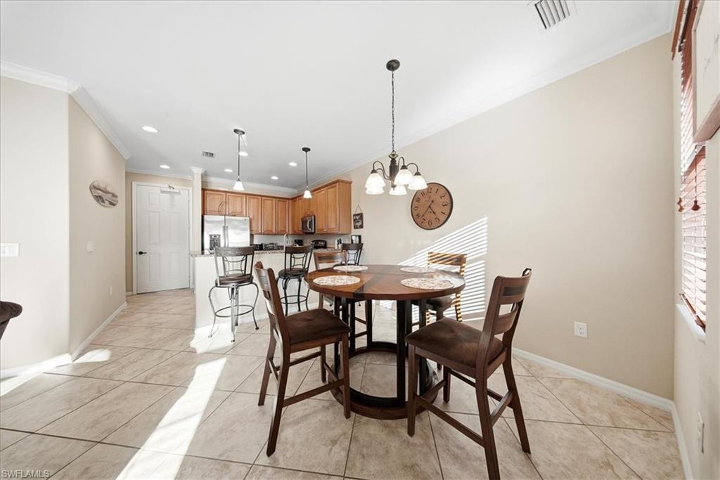 9063 Capistrano Street North, Unit 4401 Naples, FL 34113 - Photo 15 of 50 a view of a dining room and livingroom
