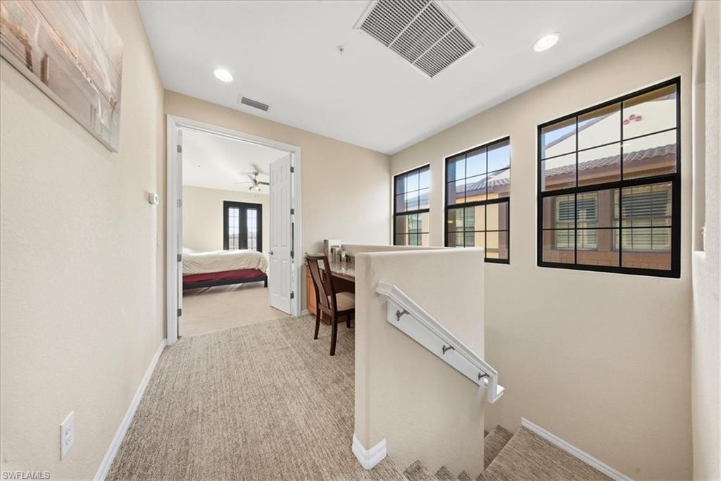 9063 Capistrano Street North, Unit 4401 Naples, FL 34113 - Photo 18 of 50 a view of a room with workspace and windows
