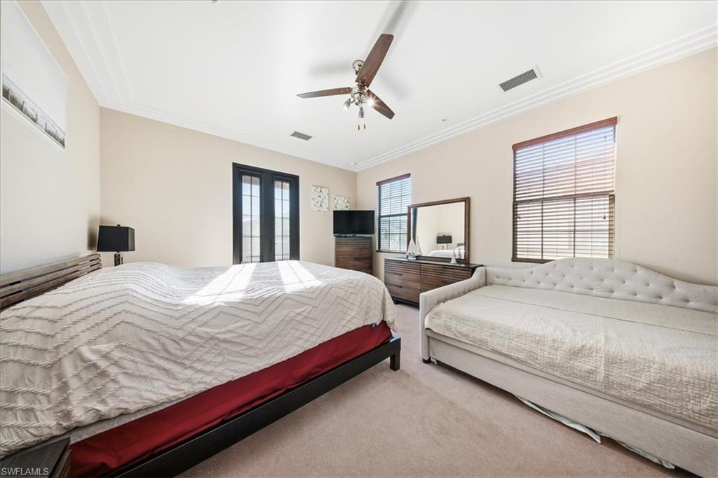 9063 Capistrano Street North, Unit 4401 Naples, FL 34113 - Photo 22 of 50 a bedroom with bed and window