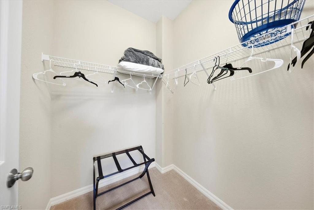 9063 Capistrano Street North, Unit 4401 Naples, FL 34113 - Photo 32 of 50 a view of a room with rack on the wall