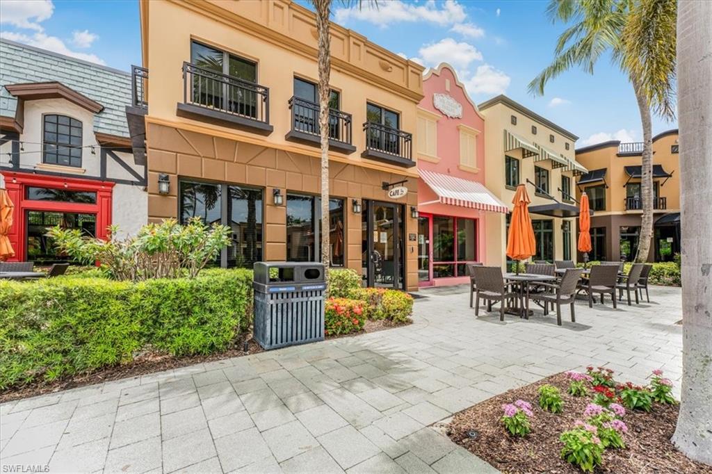 9063 Capistrano Street North, Unit 4401 Naples, FL 34113 - Photo 45 of 50 a view of a building with sitting area
