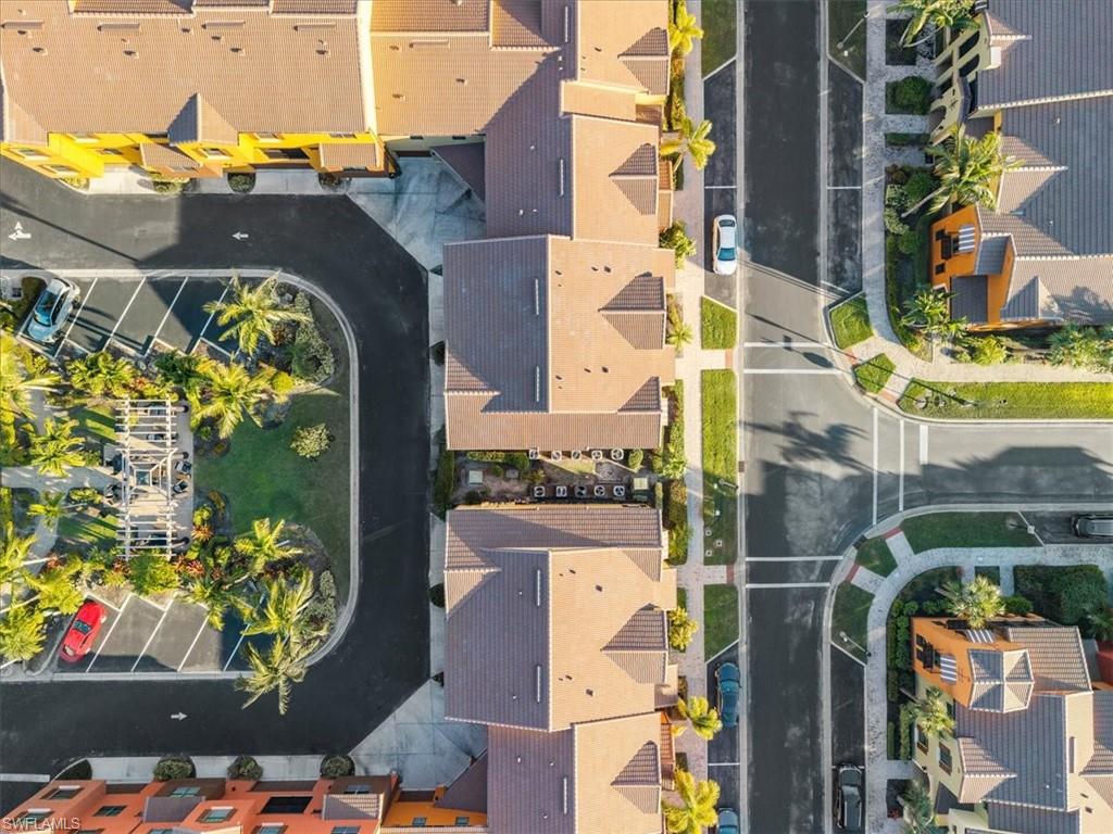 9063 Capistrano Street North, Unit 4401 Naples, FL 34113 - Photo 9 of 50 an aerial view of a residential apartment building with swimming pool