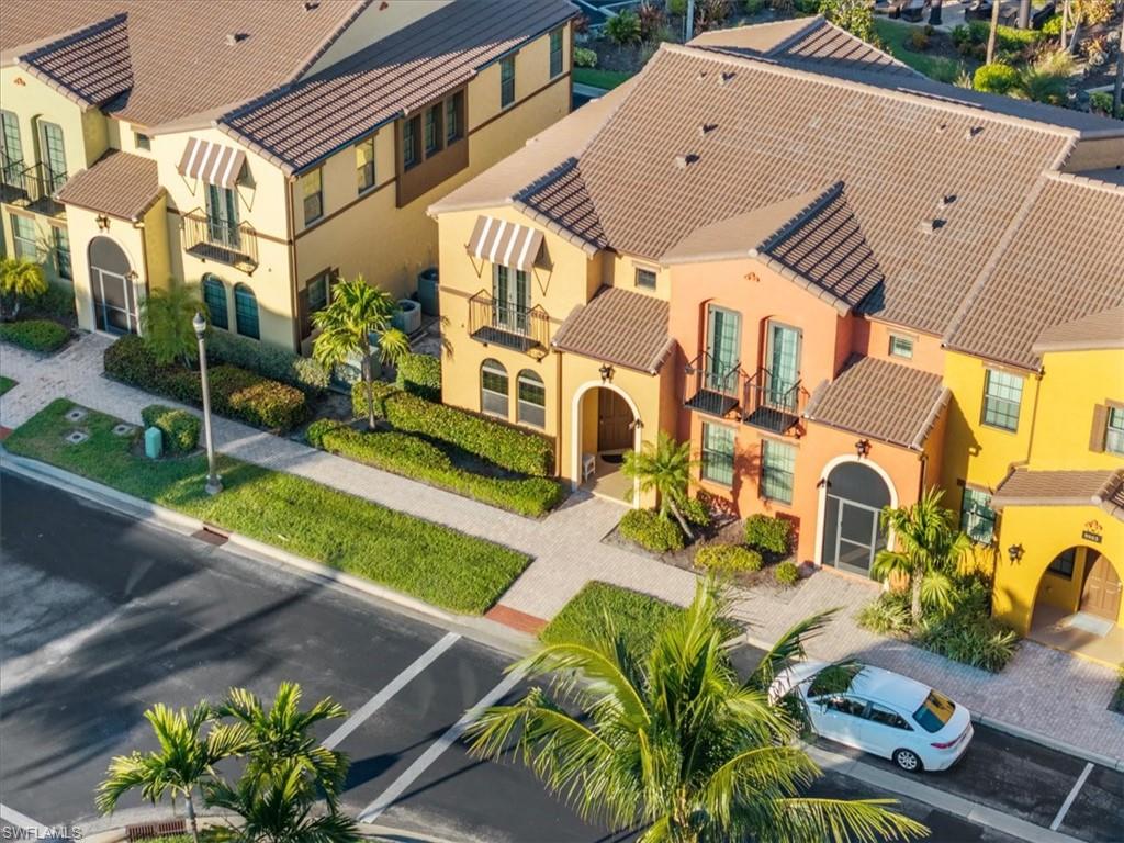 9063 Capistrano Street North, Unit 4401 Naples, FL 34113 - Photo 10 of 50 a aerial view of a house with a yard