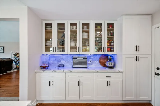 a kitchen with cabinets appliances and a window