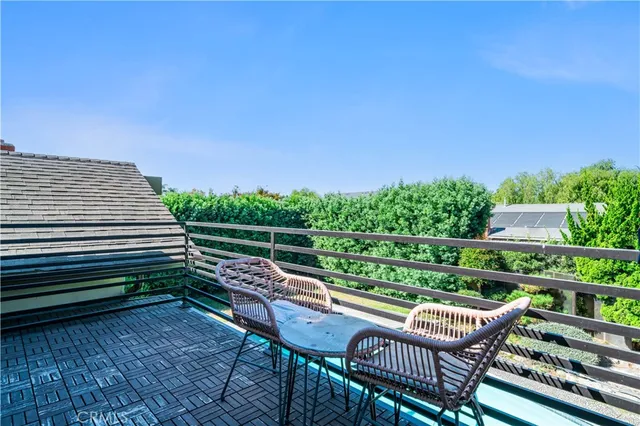 a view of a chairs and table on the wooden floor