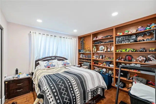 a bedroom with a bed and closet