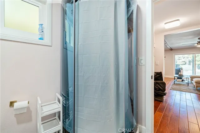a view of a living room and bathroom