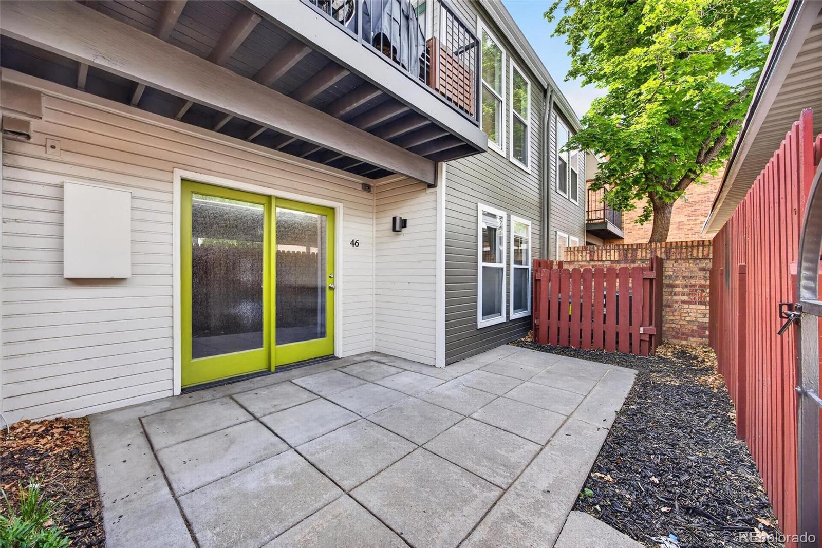1150 Inca Street, Unit 46 Denver, CO 80204 - Photo 24 of 45 a view of a porch with wooden floor and stairs