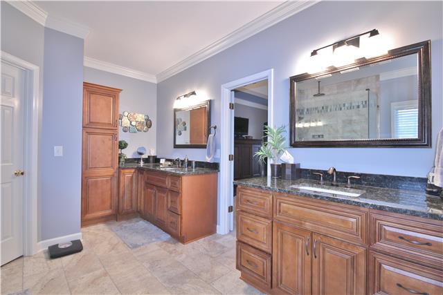 8213 Spring Ridge Drive Nashville, TN 37221 - Photo 12 of 20 Another view of the double vanities in the large master bathroom shows off the new granite and cabinets.