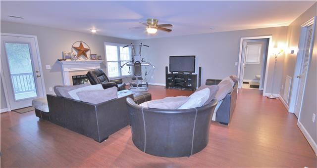 8213 Spring Ridge Drive Nashville, TN 37221 - Photo 15 of 20 The recreation/bonus room is located in the basement. It has a fireplace and also exits to the patio behind the home.