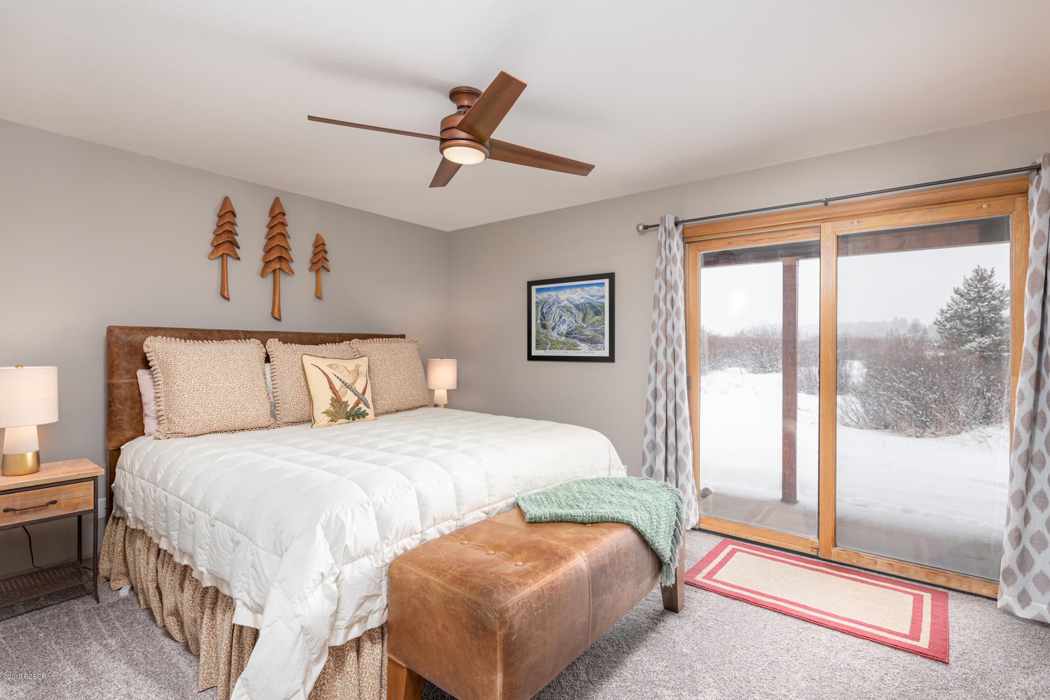 443 Muse Drive, Unit 2 Fraser, CO 80442 - Photo 12 of 26 a bedroom with a bed and glass window