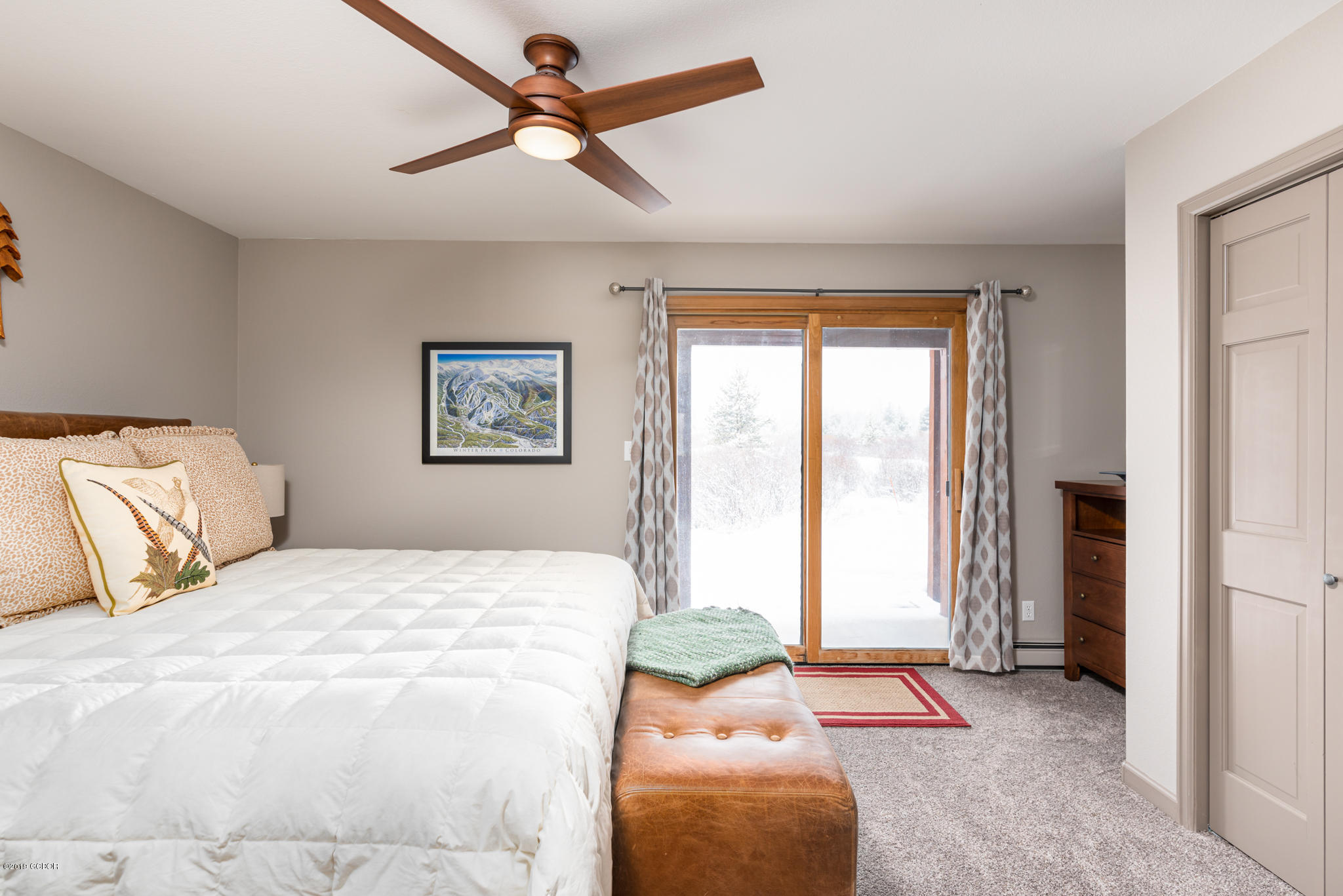 443 Muse Drive, Unit 2 Fraser, CO 80442 - Photo 14 of 26 a bedroom with a large bed and a window