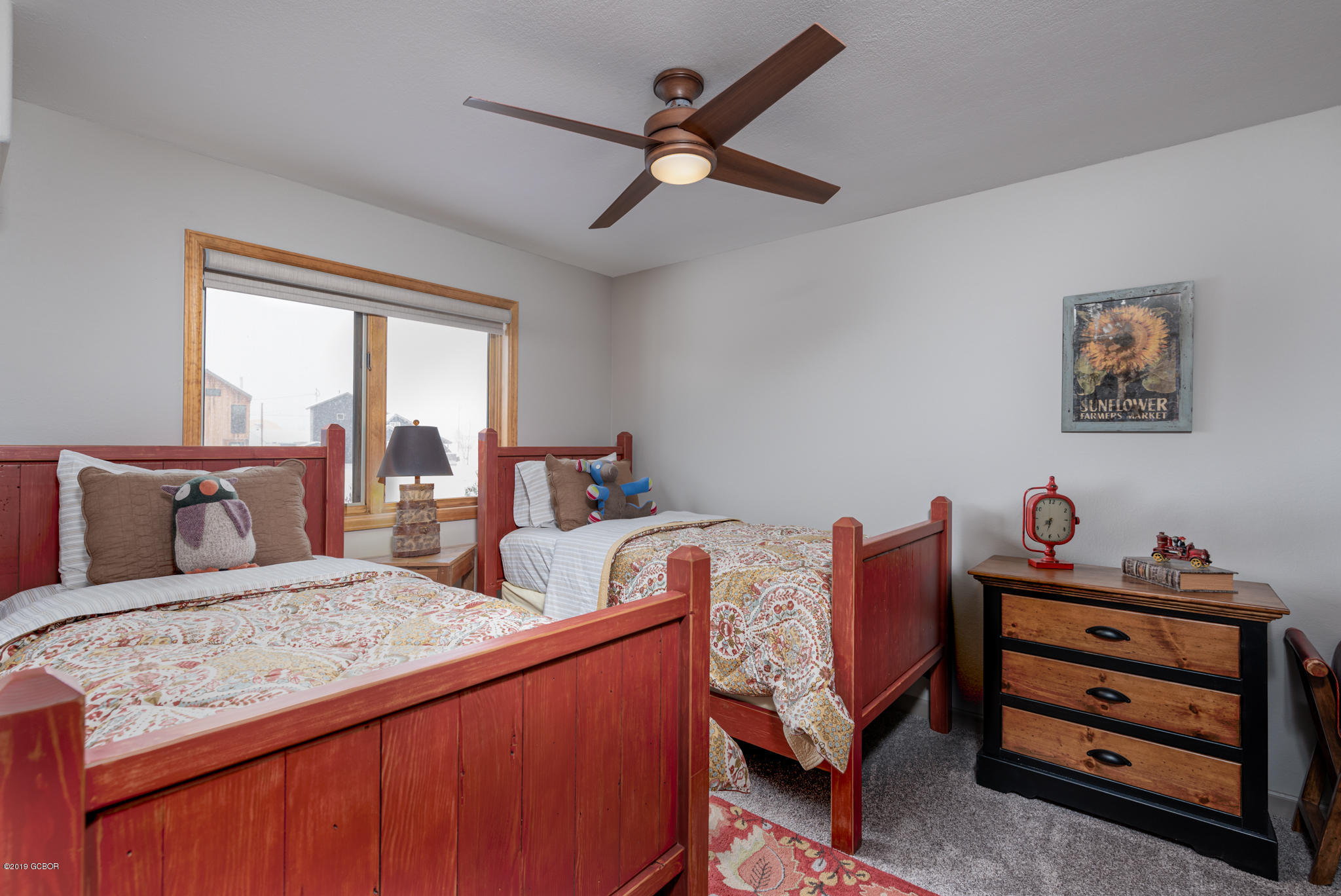 443 Muse Drive, Unit 2 Fraser, CO 80442 - Photo 15 of 26 a bedroom with a bed and wooden floor