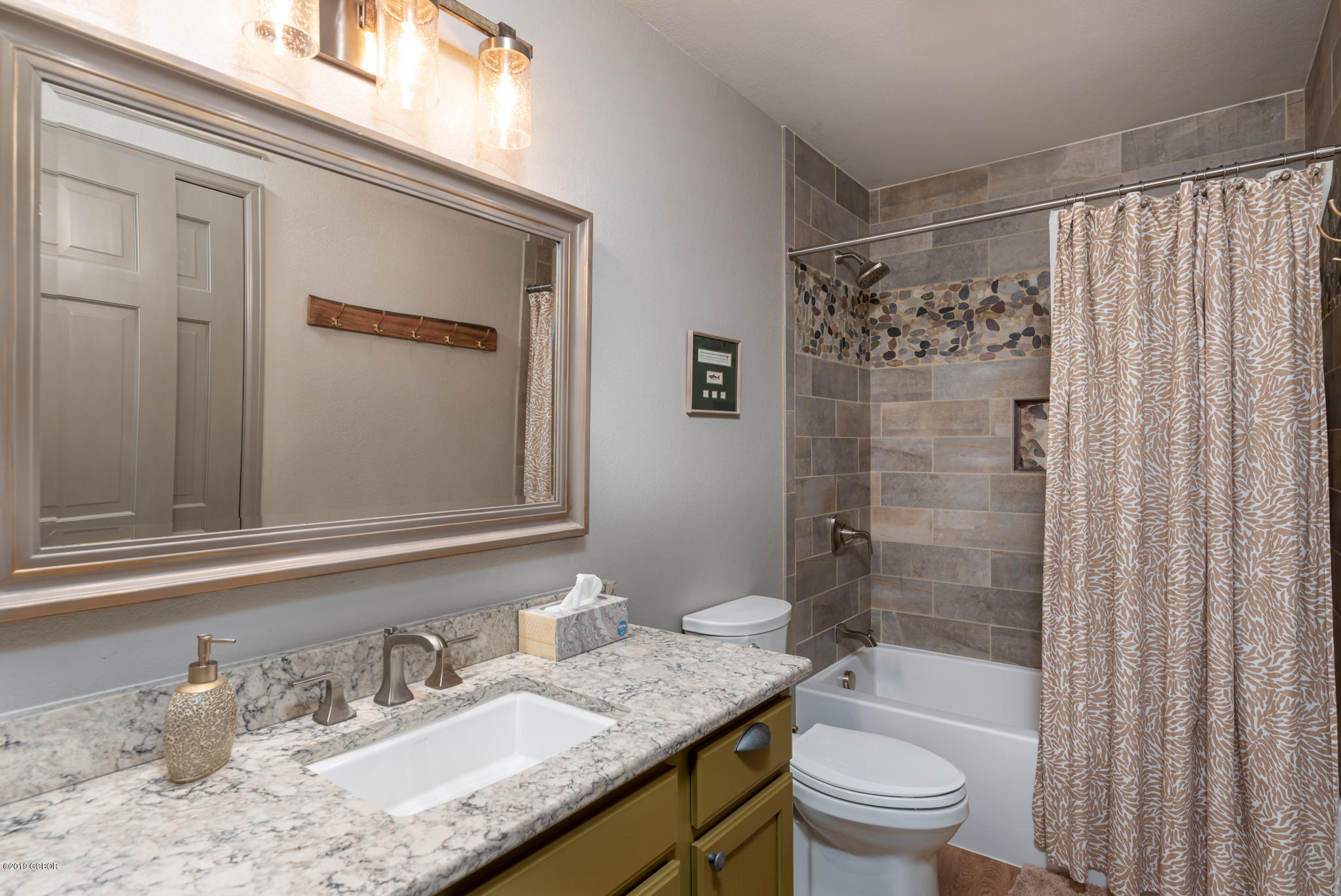443 Muse Drive, Unit 2 Fraser, CO 80442 - Photo 17 of 26 a bathroom with a granite countertop sink toilet and shower
