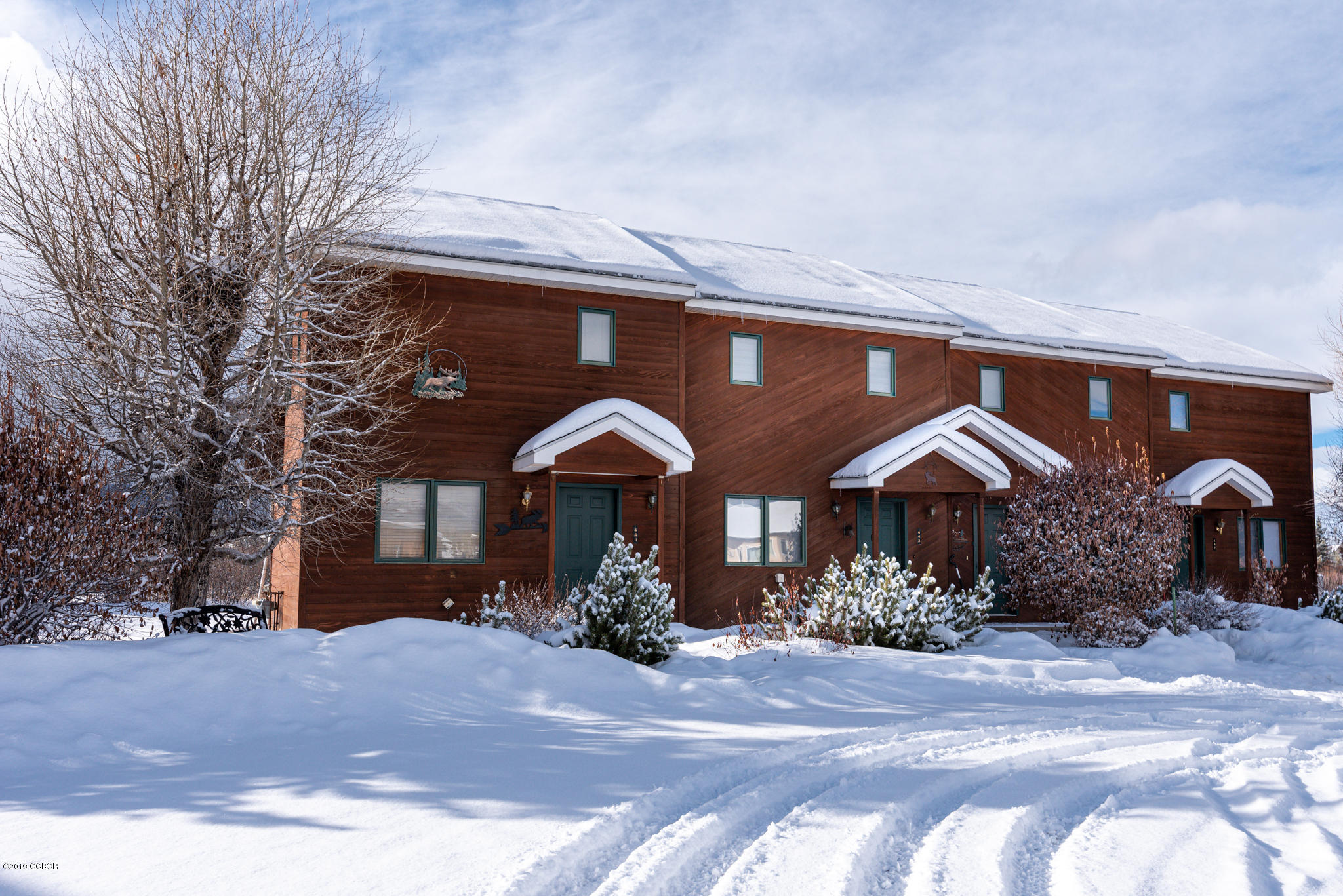 443 Muse Drive, Unit 2 Fraser, CO 80442 - Photo 2 of 26 a front view of a house with garden