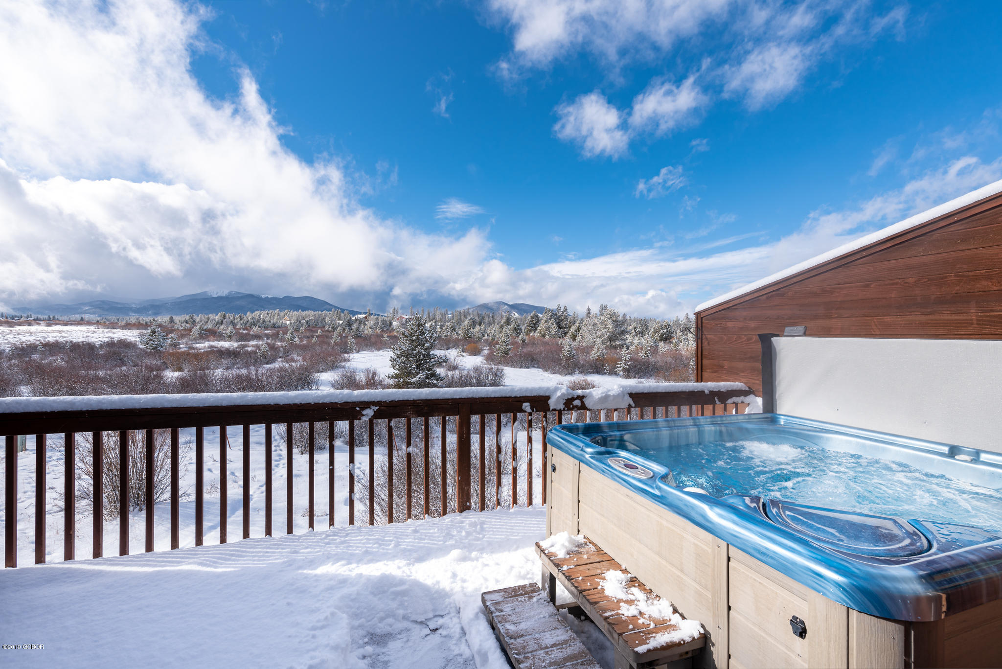 443 Muse Drive, Unit 2 Fraser, CO 80442 - Photo 5 of 26 a view of a balcony with two chairs