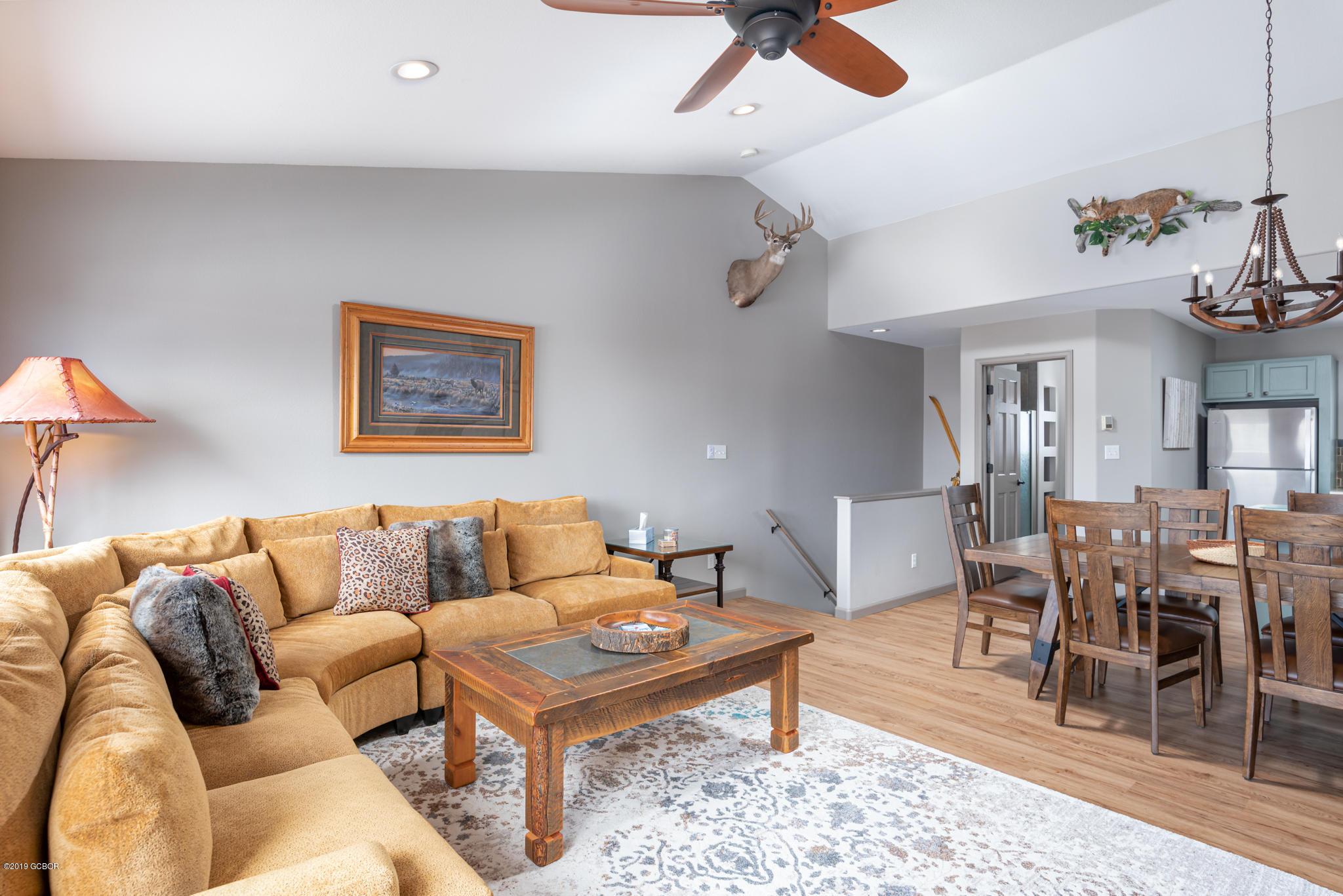 443 Muse Drive, Unit 2 Fraser, CO 80442 - Photo 10 of 26 a living room with furniture a rug and a dining table