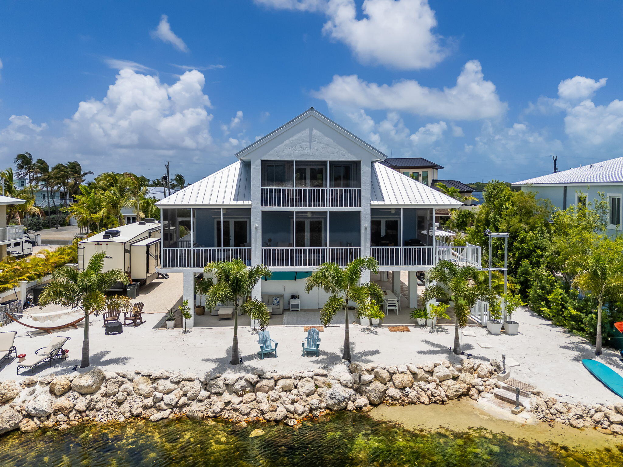 24 Mutiny Place Key Largo, FL 33037 - Photo 1 of 69 a front view of a house with garden