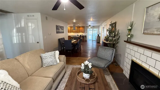 a living room with furniture and a fireplace