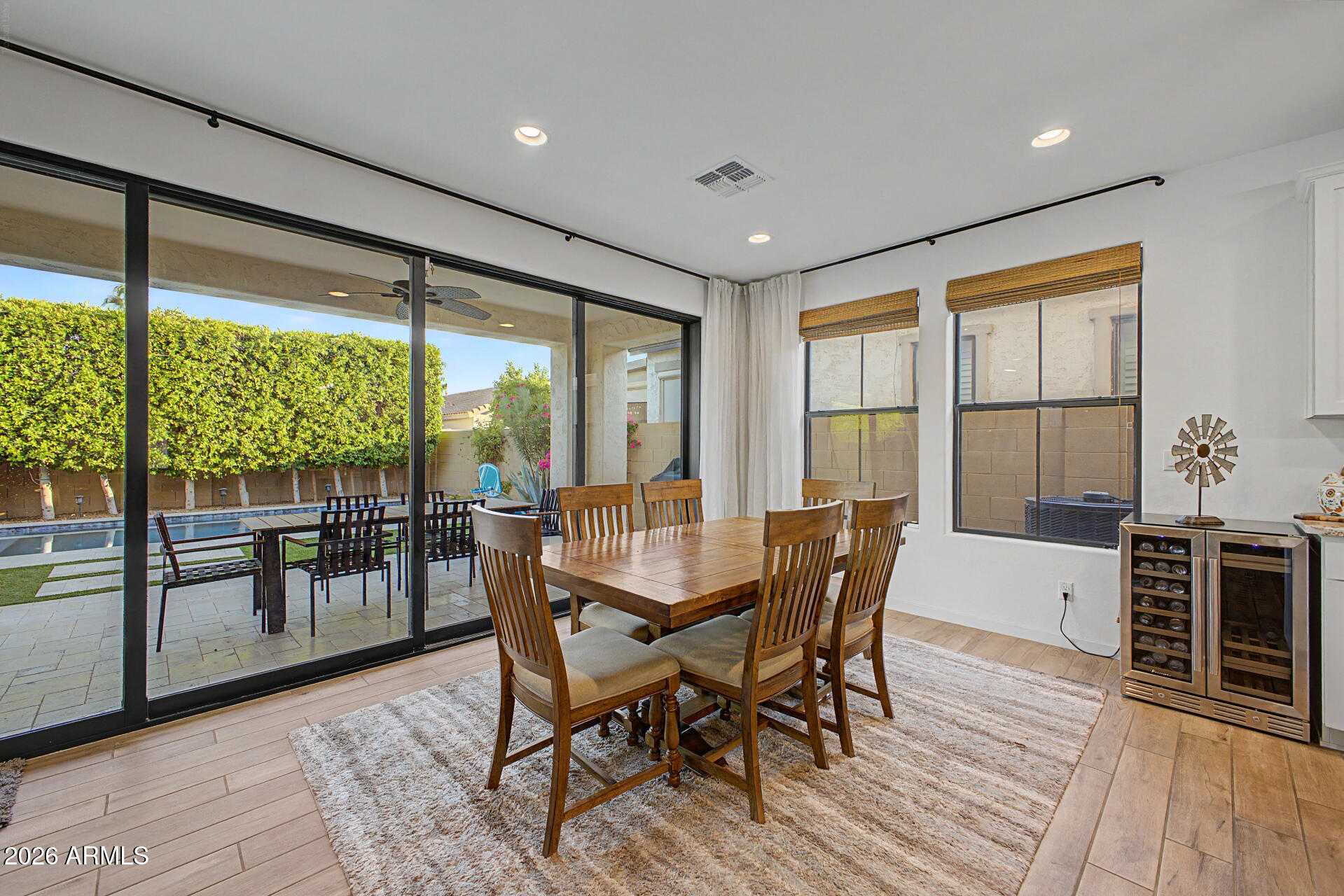819 West Deer Creek Road Phoenix, AZ 85048 - Photo 18 of 76 a view of a dining room with furniture window and wooden floor