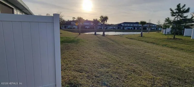 view of an swimming pool with a yard