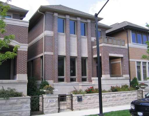 a view of a house with brick walls