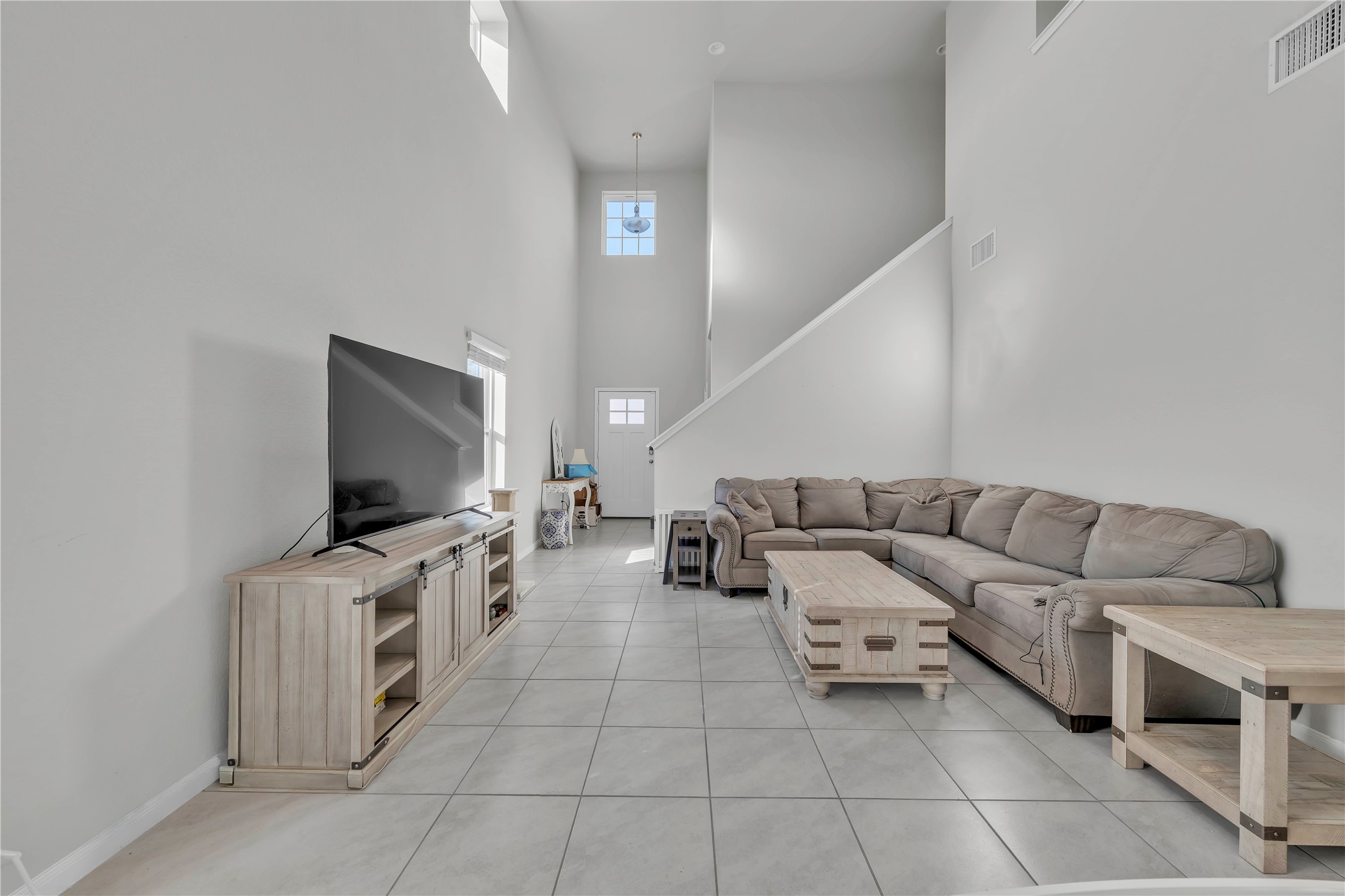 6813 Ranchito Drive Austin, TX 78744 - Photo 3 of 16 a living room with furniture and a flat screen tv
