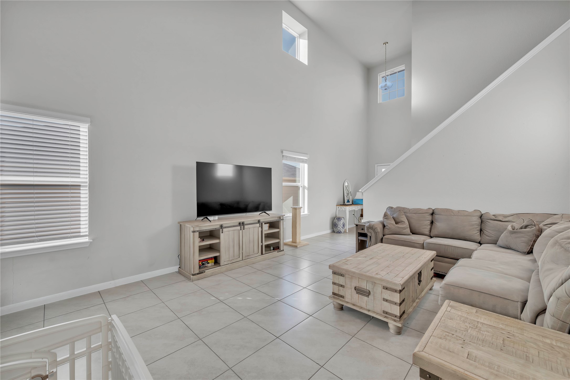 6813 Ranchito Drive Austin, TX 78744 - Photo 5 of 16 a living room with furniture and a flat screen tv