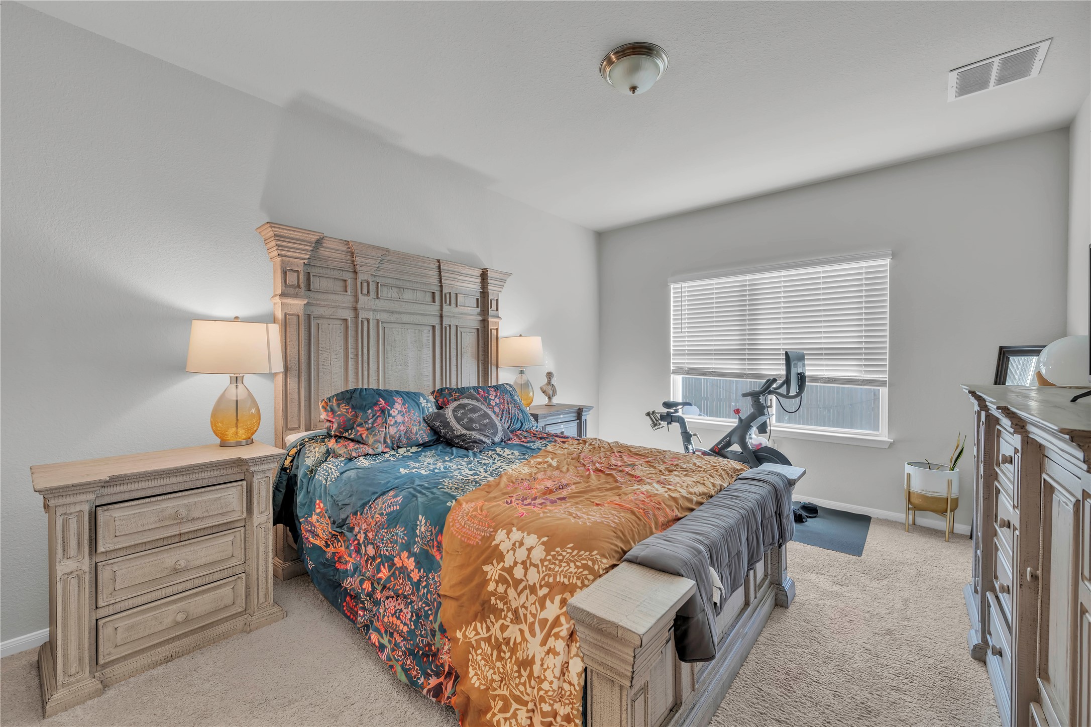 6813 Ranchito Drive Austin, TX 78744 - Photo 9 of 16 a bedroom with a bed and a window