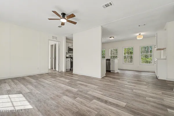 a view of an empty room with a window