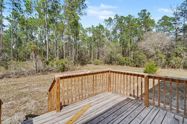 a view of balcony with wooden floor