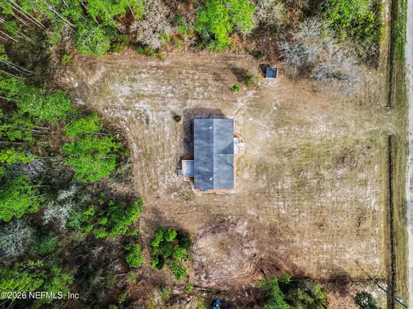 a house view with a backyard space