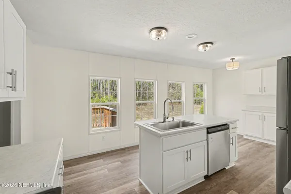 a room with a sink and a window