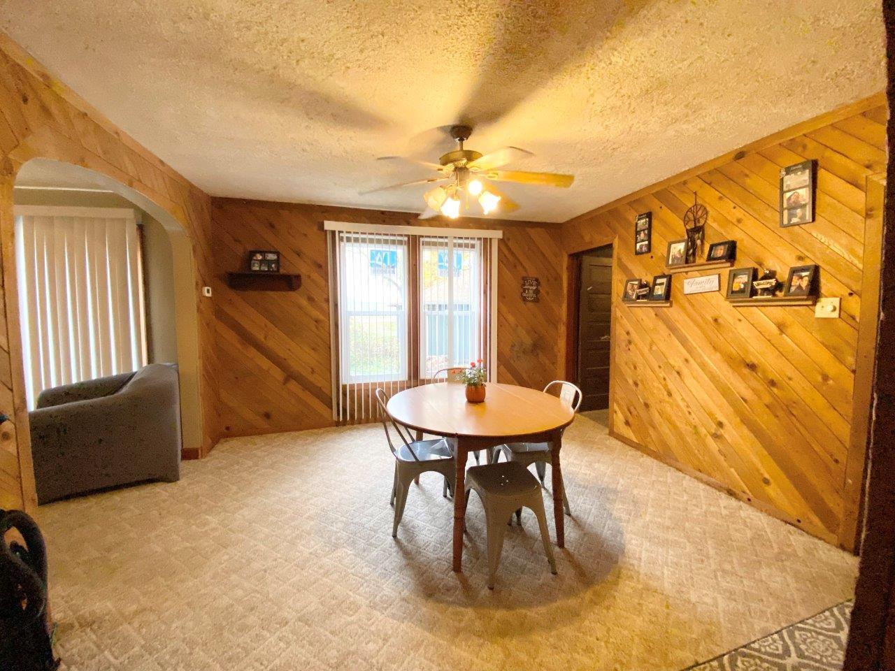 703 East Larue Street Streator, IL 61364 - Photo 11 of 38 a dining room with furniture and window