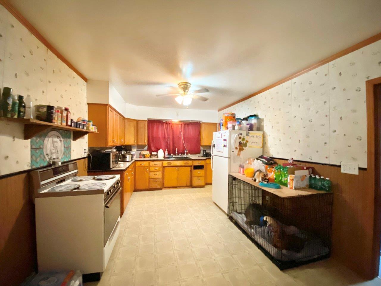 703 East Larue Street Streator, IL 61364 - Photo 12 of 38 a kitchen with stainless steel appliances kitchen island granite countertop a sink and cabinets
