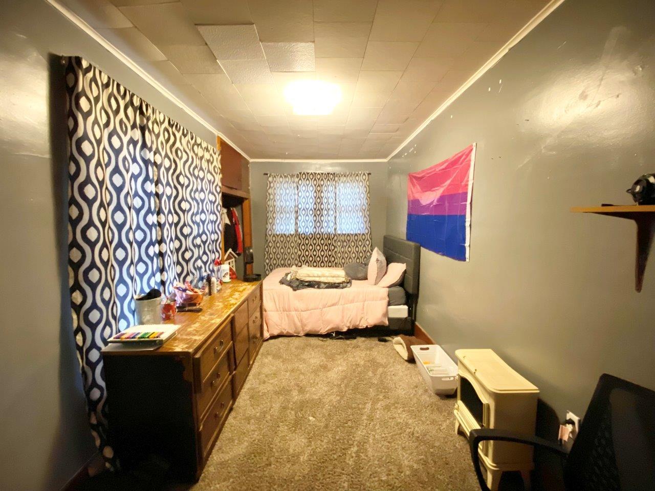 703 East Larue Street Streator, IL 61364 - Photo 15 of 38 a bed room with a bed and a couch