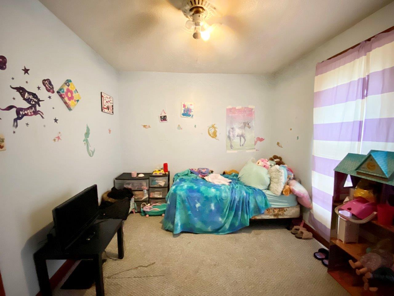 703 East Larue Street Streator, IL 61364 - Photo 16 of 38 a kids room with toys and a couch