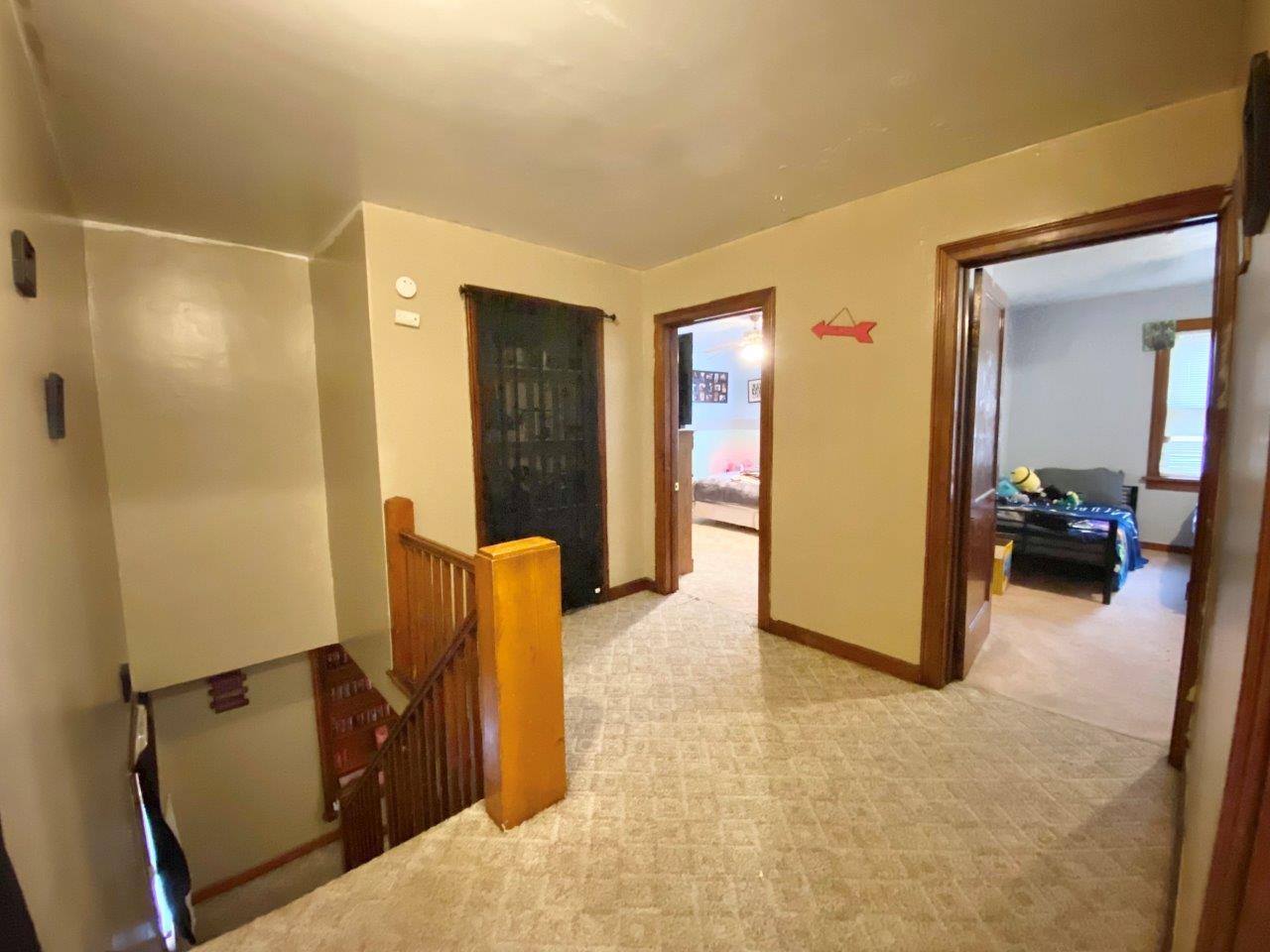 703 East Larue Street Streator, IL 61364 - Photo 18 of 38 a view of a livingroom with furniture and storage