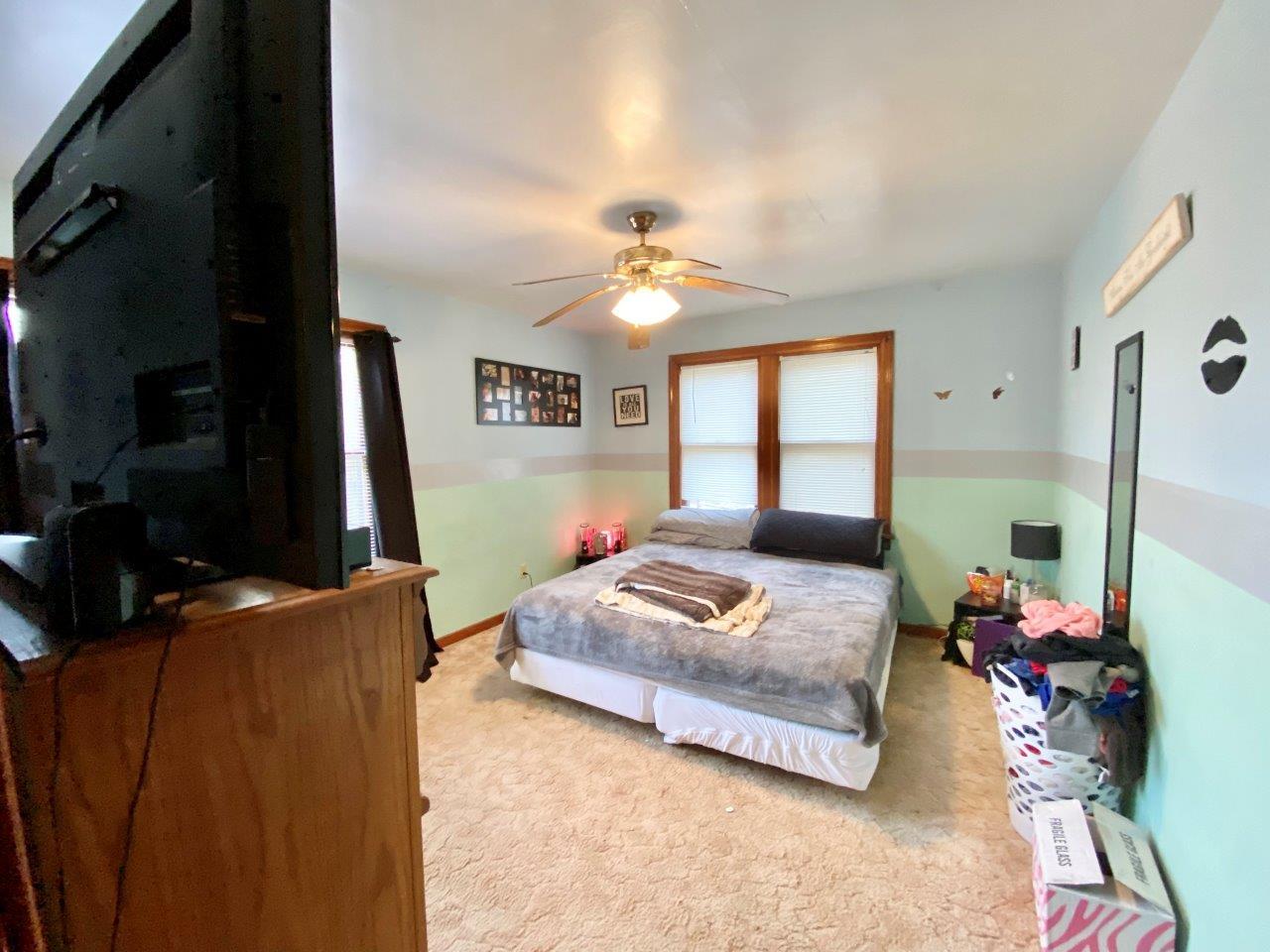 703 East Larue Street Streator, IL 61364 - Photo 21 of 38 a bedroom with furniture and a window