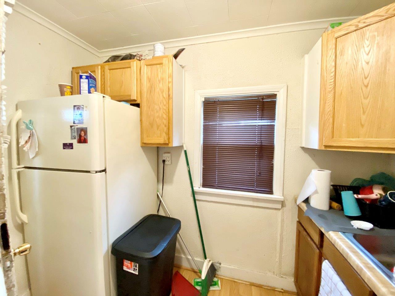 703 East Larue Street Streator, IL 61364 - Photo 29 of 38 a white refrigerator freezer sitting inside of a kitchen