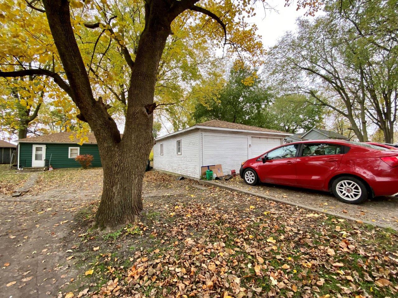 703 East Larue Street Streator, IL 61364 - Photo 36 of 38 a car parked in front of a house