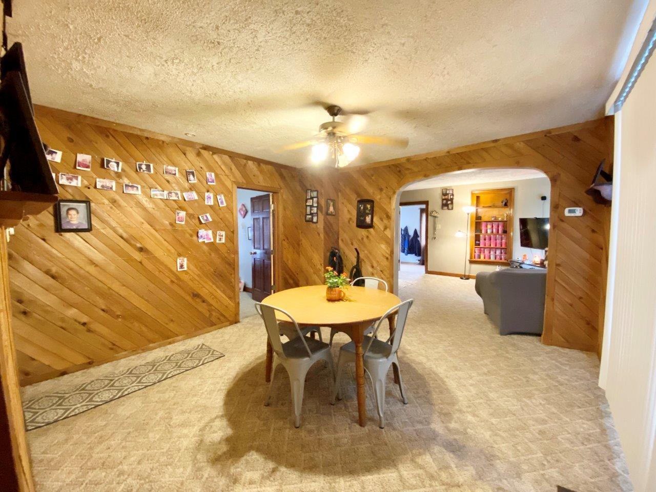 703 East Larue Street Streator, IL 61364 - Photo 10 of 38 a dining room with furniture and a chandelier