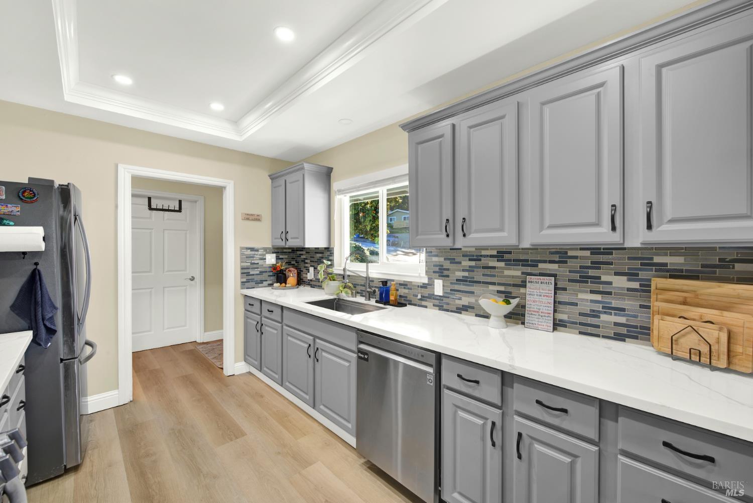 4118 Georgia Street Vallejo, CA 94591 - Photo 16 of 56 a kitchen with a sink cabinets and window