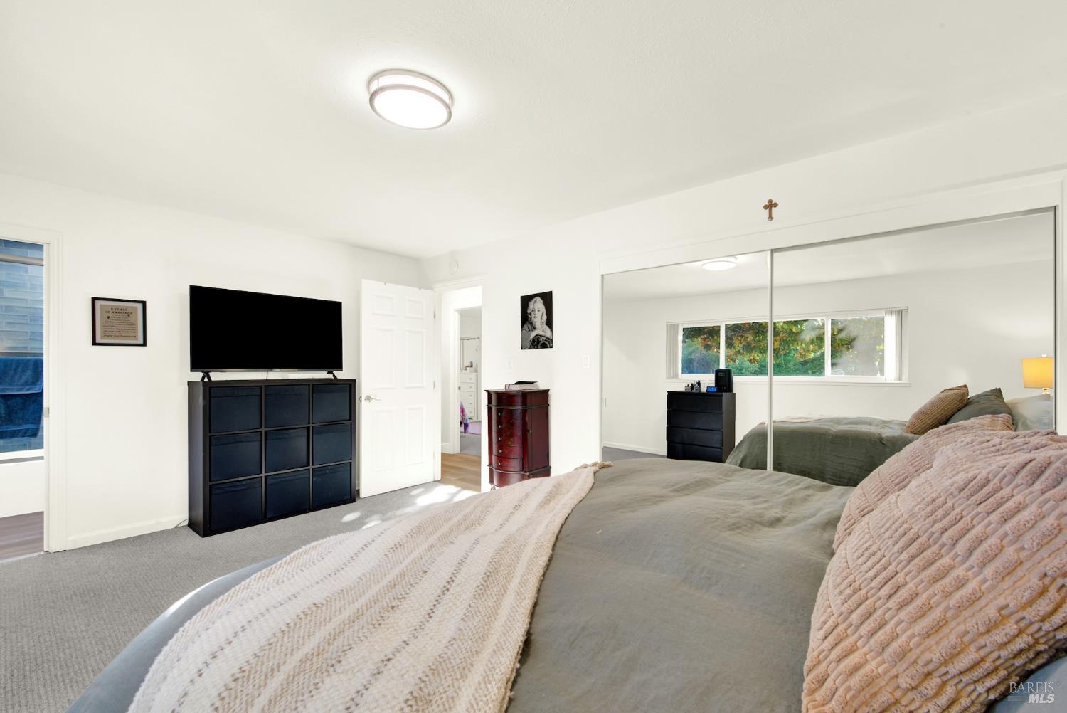 4118 Georgia Street Vallejo, CA 94591 - Photo 26 of 56 a bedroom with a bed and a flat screen tv