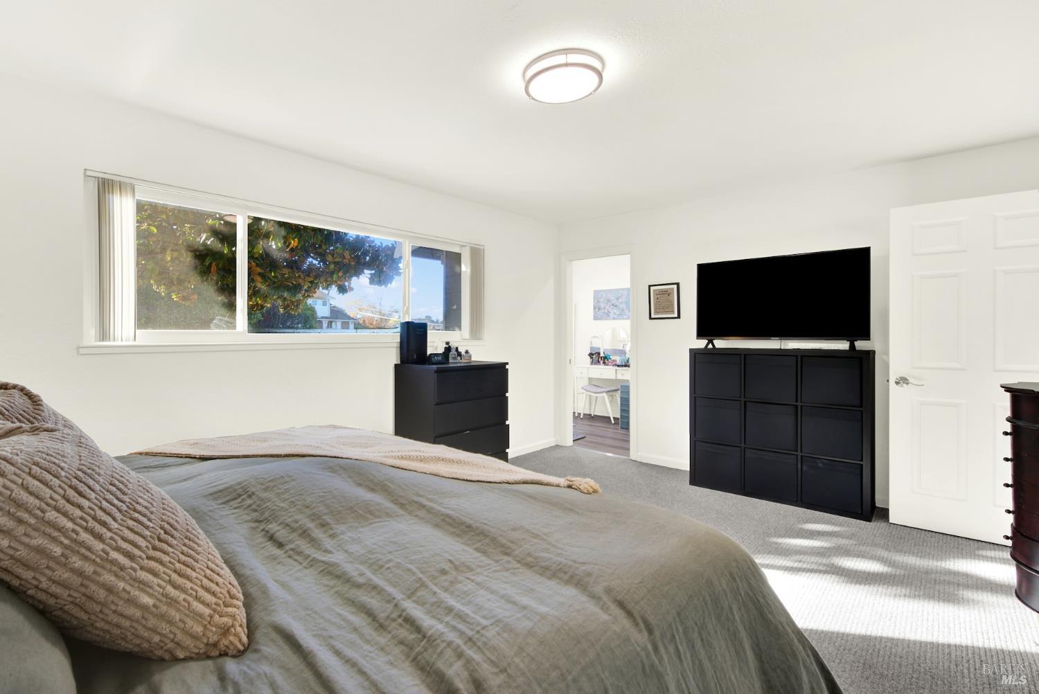 4118 Georgia Street Vallejo, CA 94591 - Photo 28 of 56 a bedroom with a bed and a flat screen tv