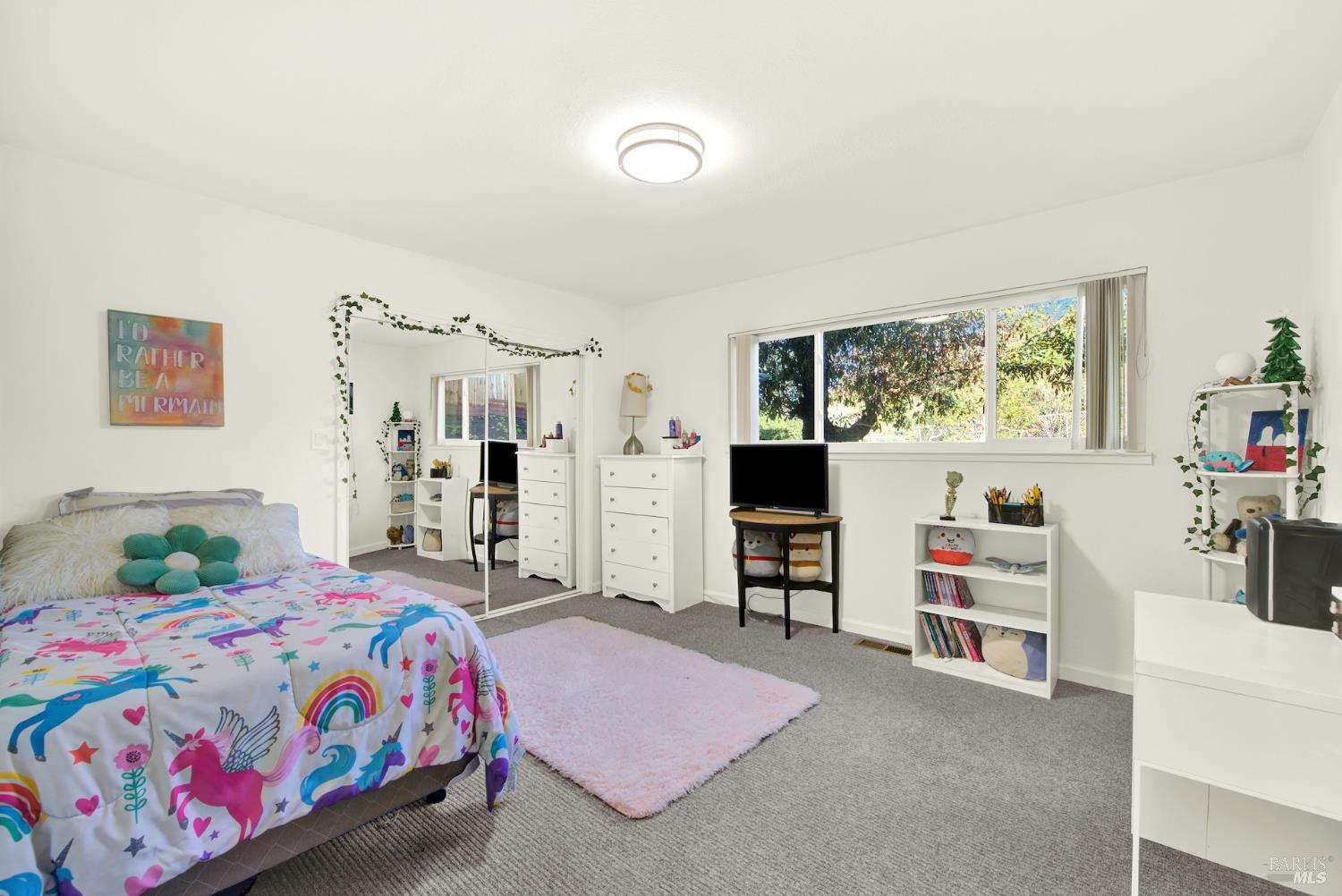 4118 Georgia Street Vallejo, CA 94591 - Photo 29 of 56 a bedroom with a bed and a desk