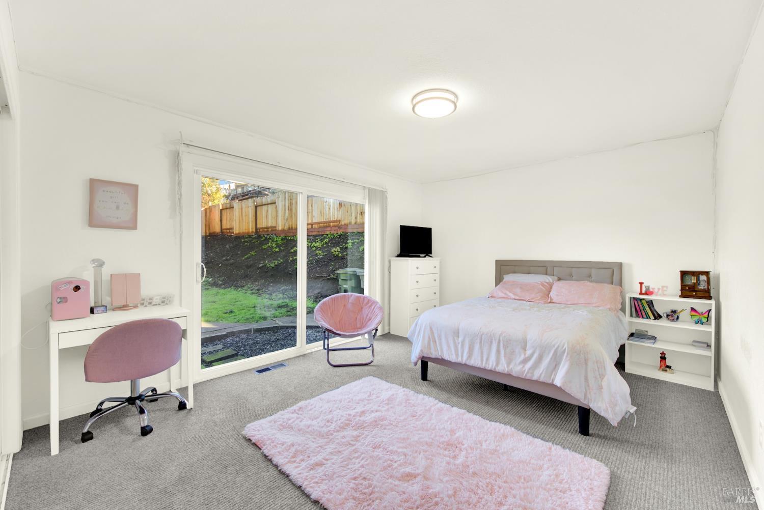 4118 Georgia Street Vallejo, CA 94591 - Photo 31 of 56 a bedroom with a bed and large windows