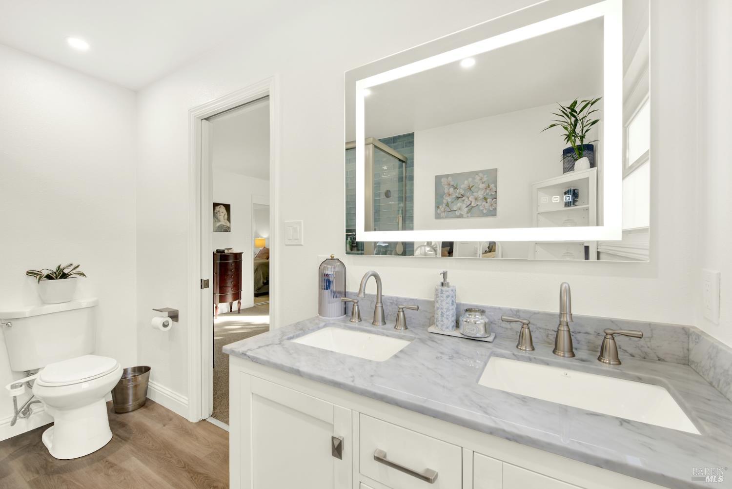 4118 Georgia Street Vallejo, CA 94591 - Photo 35 of 56 a bathroom with a granite countertop sink mirror and toilet