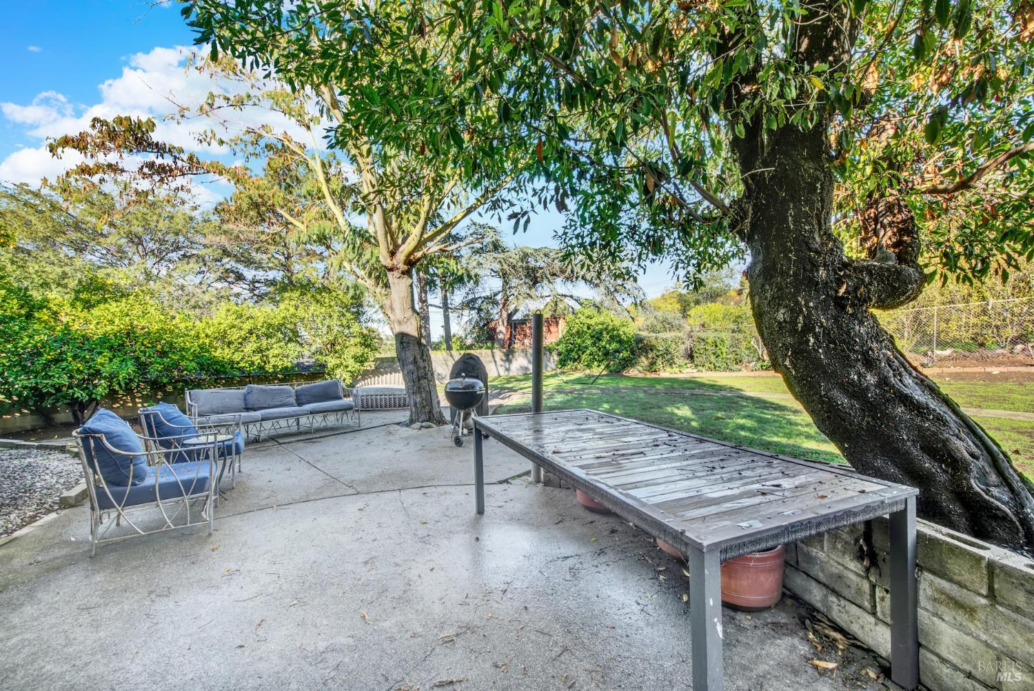 4118 Georgia Street Vallejo, CA 94591 - Photo 46 of 56 a wooden bench sitting in middle of a yard