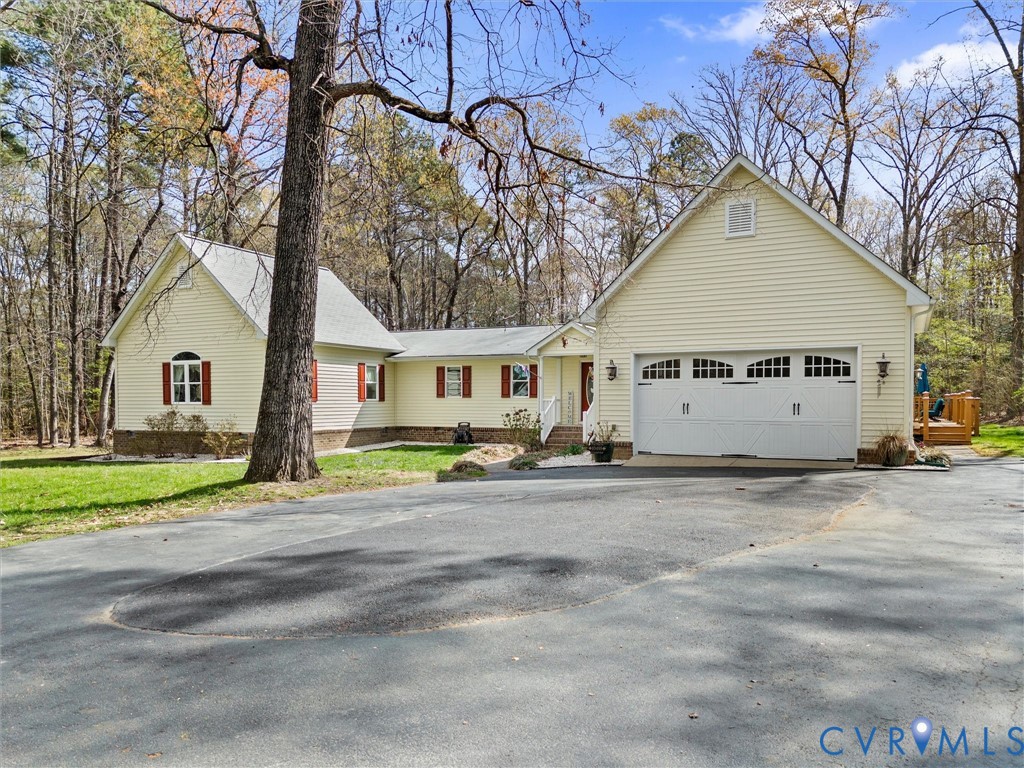 10488 Old Telegraph Road Ashland, VA 23005 - Photo 2 of 69 a view of a house with a yard and garage